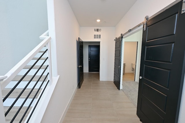 510 W Mahogany Ln, Clovis, CA 93611 - hall featuring a barn door, light tile patterned floors, plenty of natural light, and recessed lighting