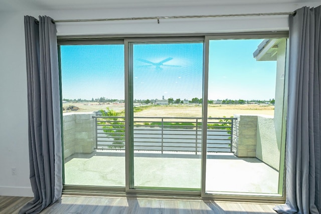 510 W Mahogany Ln, Clovis, CA 93611 - doorway to outside featuring healthy amount of natural light and wood finished floors