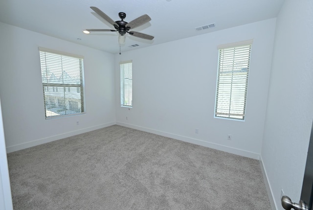 510 W Mahogany Ln, Clovis, CA 93611 - empty room with plenty of natural light, ceiling fan, and carpet floors