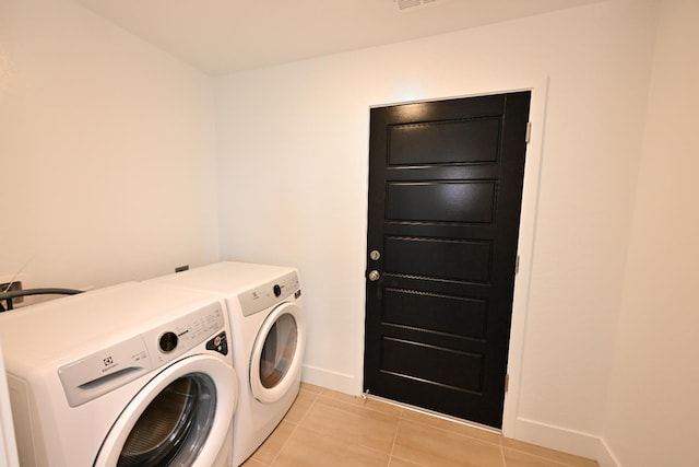 510 W Mahogany Ln, Clovis, CA 93611 - laundry room featuring washer and clothes dryer and light tile patterned floors