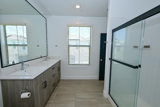 510 W Mahogany Ln, Clovis, CA 93611 - full bath with double vanity, an enclosed shower, and tile patterned flooring