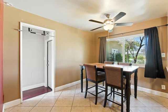 6052 N Spalding Ave, Fresno, CA 93710 - dining room with light tile patterned floors and a ceiling fan