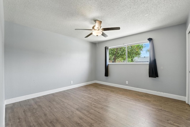 6052 N Spalding Ave, Fresno, CA 93710 - empty room featuring ceiling fan, wood finished floors, and a textured ceiling