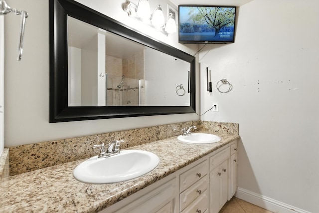 6052 N Spalding Ave, Fresno, CA 93710 - bathroom with double vanity, tiled shower, and tile patterned flooring