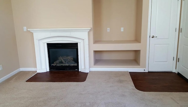 1982 N Todd Hedrick, Clovis, CA 93619 - detailed view of carpet floors, built in shelves, a glass covered fireplace, and wood finished floors