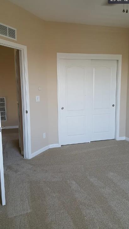 1982 N Todd Hedrick, Clovis, CA 93619 - unfurnished bedroom featuring carpet floors and a closet