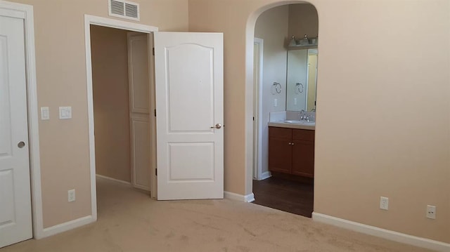 1982 N Todd Hedrick, Clovis, CA 93619 - unfurnished bedroom featuring arched walkways, carpet flooring, and ensuite bath