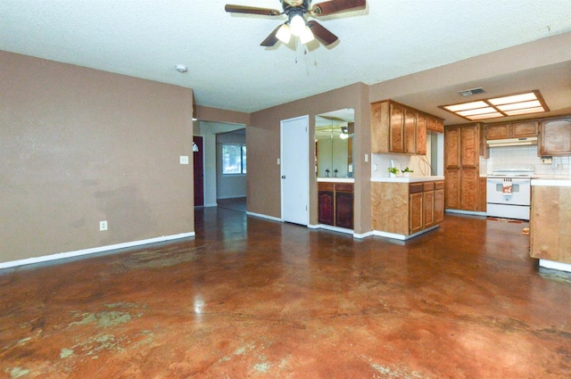 1325 Griffith Ave, Clovis, CA 93612 - kitchen featuring white electric range, brown cabinets, finished concrete flooring, ceiling fan, and light countertops