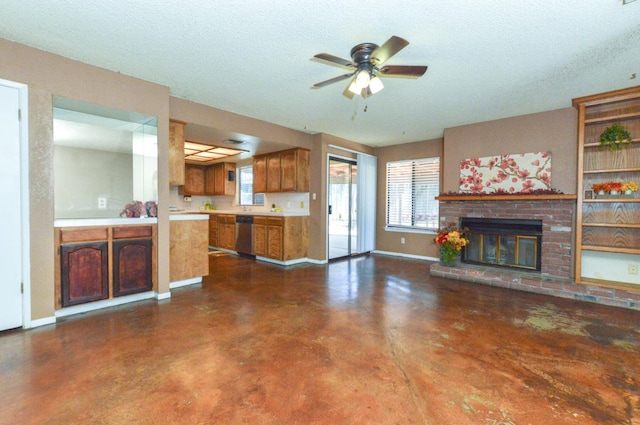1325 Griffith Ave, Clovis, CA 93612 - unfurnished living room with finished concrete flooring, ceiling fan, a fireplace, and a textured ceiling
