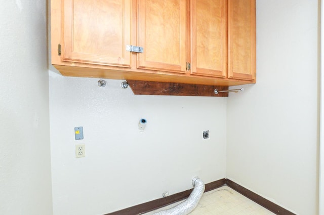 1325 Griffith Ave, Clovis, CA 93612 - washroom featuring hookup for an electric dryer, gas dryer hookup, cabinet space, and tile patterned floors