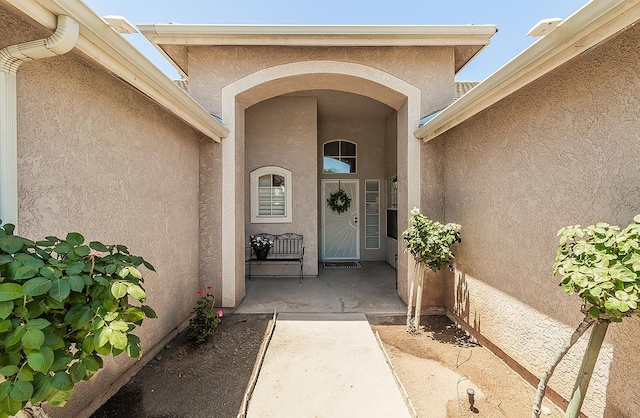 5783 N State St, Fresno, CA 93722 - doorway to property featuring stucco siding