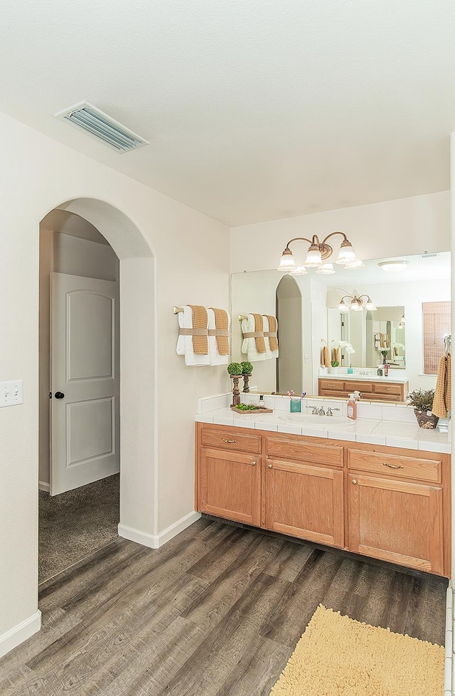 5783 N State St, Fresno, CA 93722 - bathroom with wood finished floors and vanity