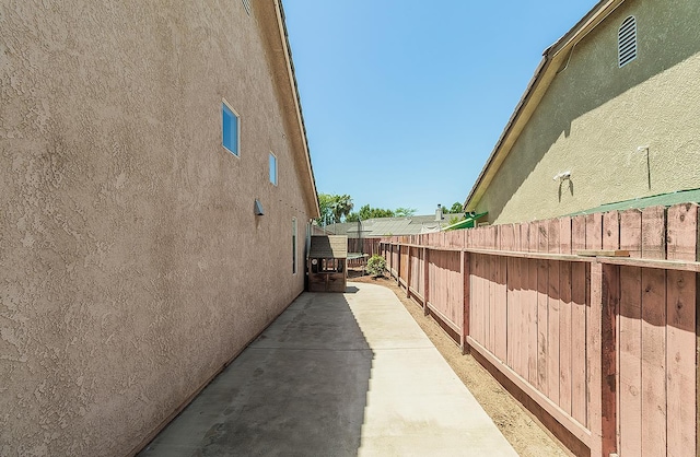 5783 N State St, Fresno, CA 93722 - view of property exterior featuring stucco siding and a patio
