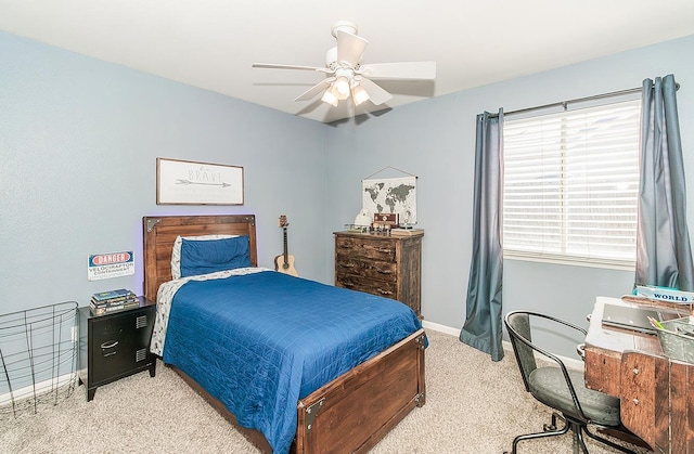 5783 N State St, Fresno, CA 93722 - carpeted bedroom with baseboards and a ceiling fan