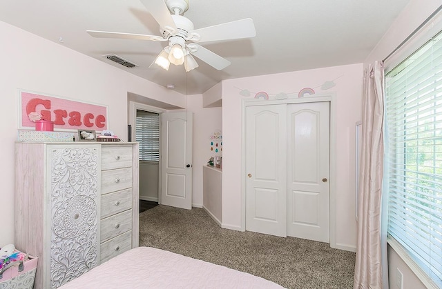 5783 N State St, Fresno, CA 93722 - bedroom featuring dark carpet, a closet, and a ceiling fan