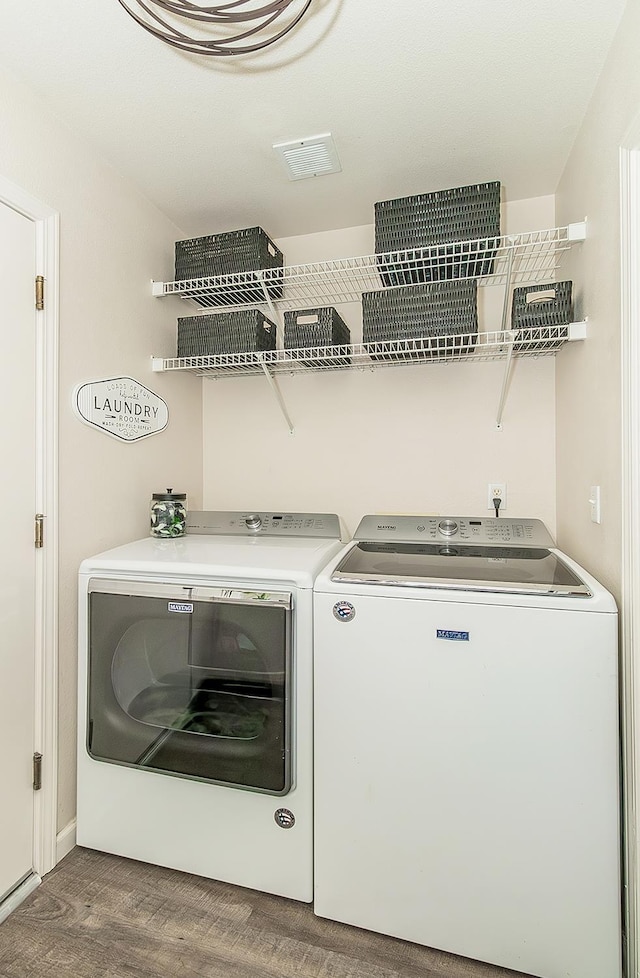 5783 N State St, Fresno, CA 93722 - washroom with washing machine and dryer and wood finished floors