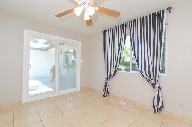 4879 E San Gabriel Ave, Fresno, CA 93726 - spare room featuring light tile patterned floors and a ceiling fan