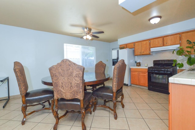 4879 E San Gabriel Ave, Fresno, CA 93726 - dining space featuring a ceiling fan and light tile patterned flooring