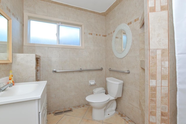 4879 E San Gabriel Ave, Fresno, CA 93726 - bathroom featuring tile patterned flooring, tile walls, and vanity