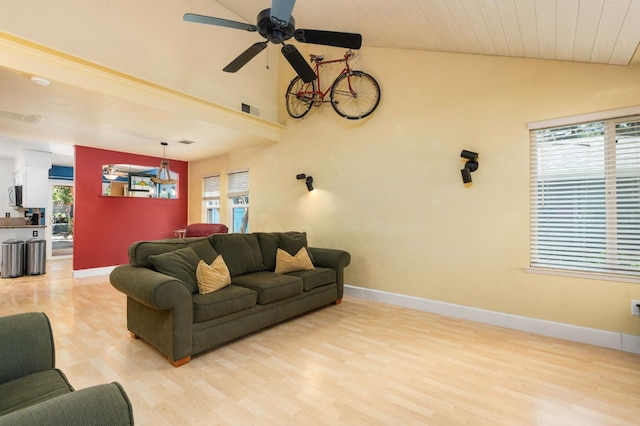 9938 N Canyon Creek Ln, Fresno, CA 93730 - living room featuring vaulted ceiling, plenty of natural light, a ceiling fan, and light wood-type flooring