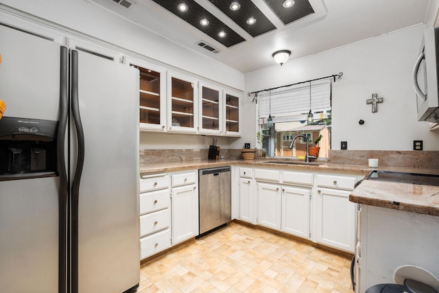 9938 N Canyon Creek Ln, Fresno, CA 93730 - kitchen featuring fridge with ice dispenser, dishwasher, white cabinets, glass insert cabinets, and light stone counters