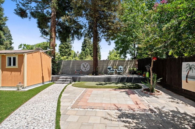 9938 N Canyon Creek Ln, Fresno, CA 93730 - fenced backyard with a storage shed and a patio