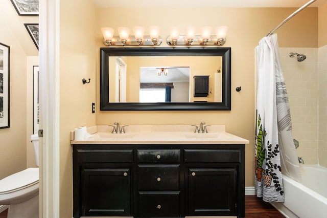 9938 N Canyon Creek Ln, Fresno, CA 93730 - full bathroom featuring double vanity, shower / tub combo, and wood finished floors