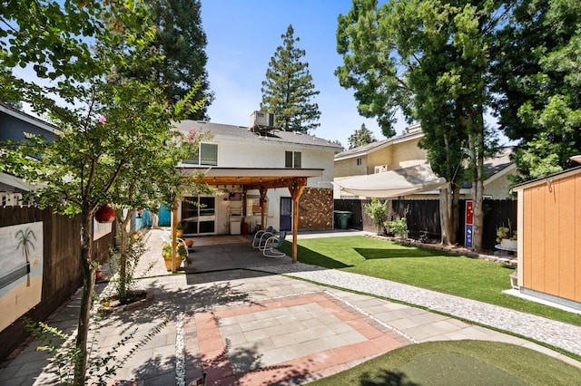 9938 N Canyon Creek Ln, Fresno, CA 93730 - rear view of house with a patio area, stucco siding, and a fenced backyard