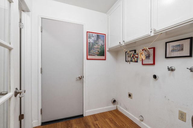9938 N Canyon Creek Ln, Fresno, CA 93730 - laundry room featuring gas dryer hookup, cabinet space, wood finished floors, and electric dryer hookup
