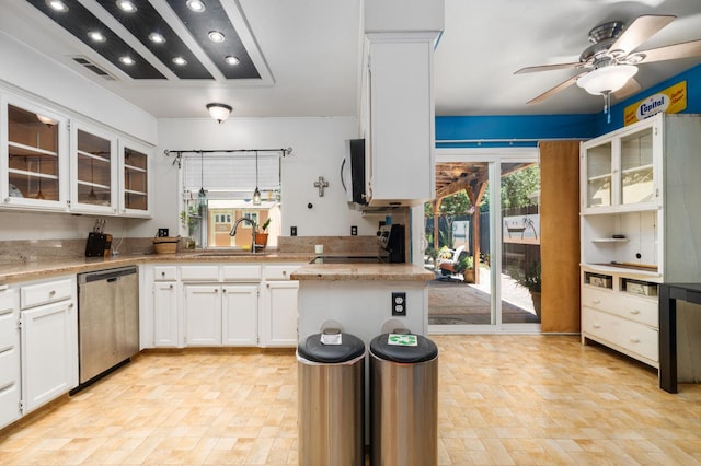9938 N Canyon Creek Ln, Fresno, CA 93730 - kitchen featuring dishwasher, range, ceiling fan, glass insert cabinets, and recessed lighting