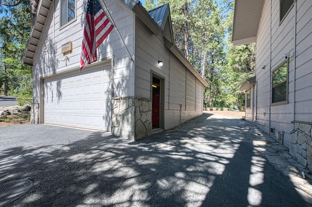 41798 Saddleback Rd, Shaver Lake, CA 93664 - view of home's exterior featuring a garage and asphalt driveway