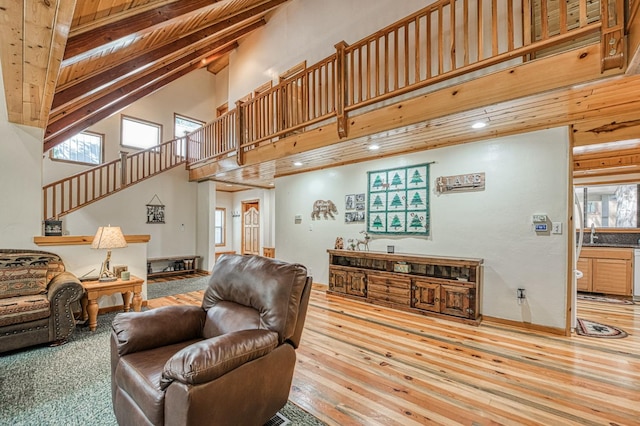 41798 Saddleback Rd, Shaver Lake, CA 93664 - living room with high vaulted ceiling, stairway, plenty of natural light, wood-type flooring, and recessed lighting
