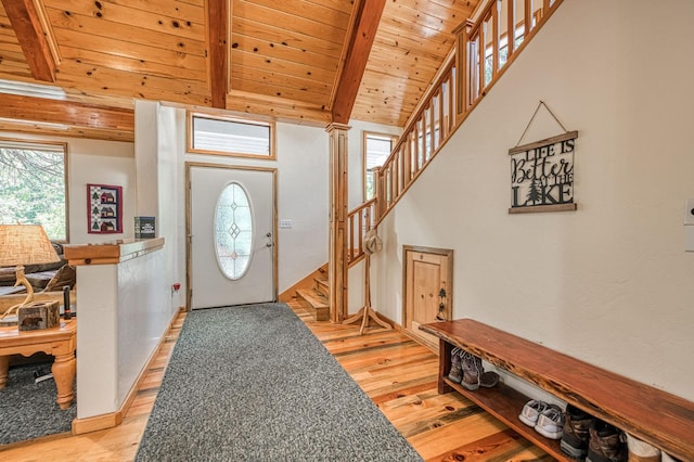 41798 Saddleback Rd, Shaver Lake, CA 93664 - foyer entrance featuring a wood ceiling with exposed beams, light wood finished floors, and stairs