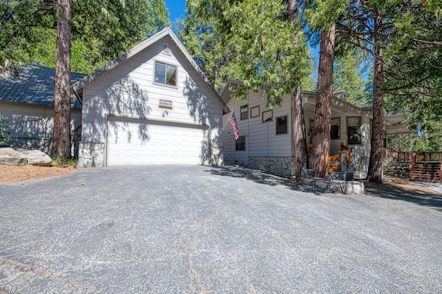 41798 Saddleback Rd, Shaver Lake, CA 93664 - view of front facade with a garage and asphalt driveway