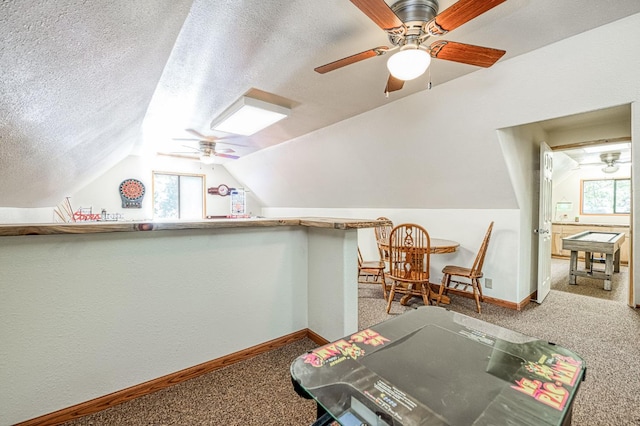 41798 Saddleback Rd, Shaver Lake, CA 93664 - additional living space featuring a ceiling fan, carpet floors, healthy amount of natural light, vaulted ceiling, and a textured ceiling