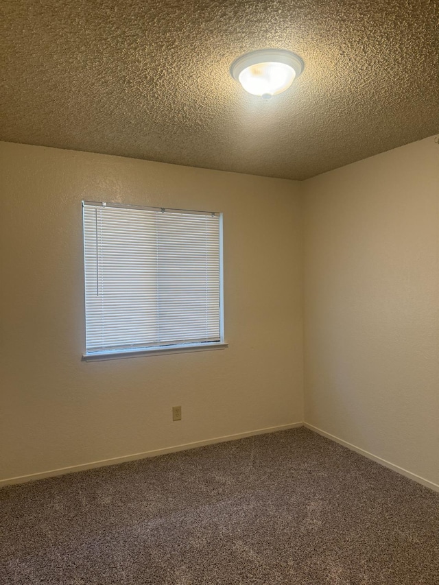 4303 N Emerson Ave, Fresno, CA 93705 - carpeted empty room featuring a textured ceiling