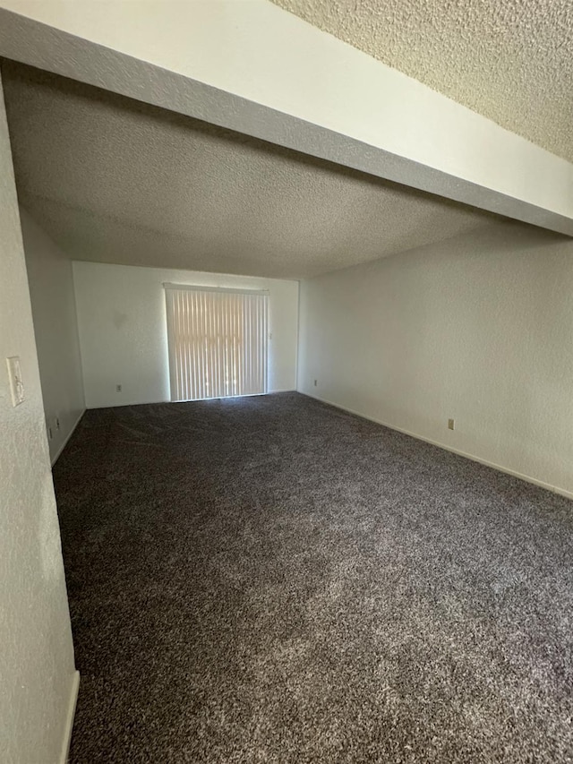 4303 N Emerson Ave, Fresno, CA 93705 - carpeted empty room featuring a textured ceiling