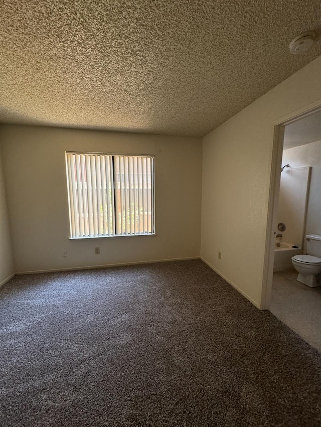 4303 N Emerson Ave, Fresno, CA 93705 - spare room featuring carpet, a textured ceiling, and a smoke detector