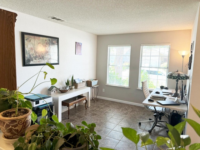 650 N Burgan Ave, Fresno, CA 93727 - tiled home office featuring a textured ceiling