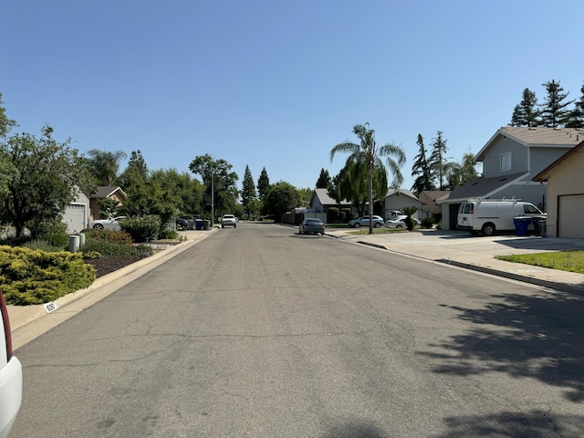650 N Burgan Ave, Fresno, CA 93727 - view of asphalt road featuring a residential view and curbs