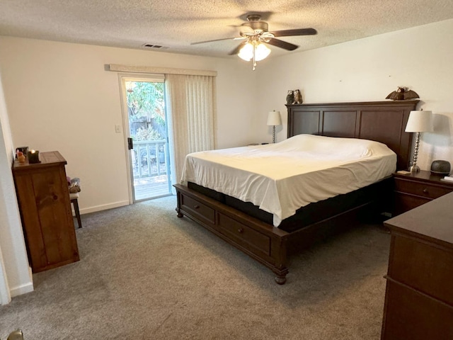650 N Burgan Ave, Fresno, CA 93727 - bedroom featuring access to exterior, a textured ceiling, carpet floors, and a ceiling fan