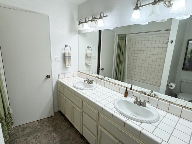 650 N Burgan Ave, Fresno, CA 93727 - full bathroom featuring double vanity and a shower with shower curtain