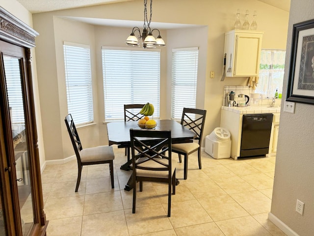 650 N Burgan Ave, Fresno, CA 93727 - dining space with light tile patterned floors and a chandelier