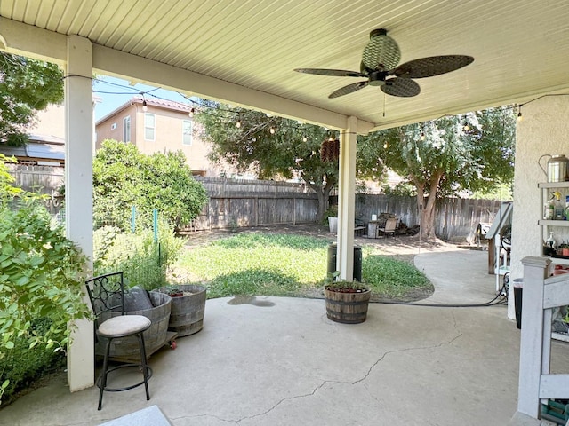 650 N Burgan Ave, Fresno, CA 93727 - fenced backyard with a patio and ceiling fan