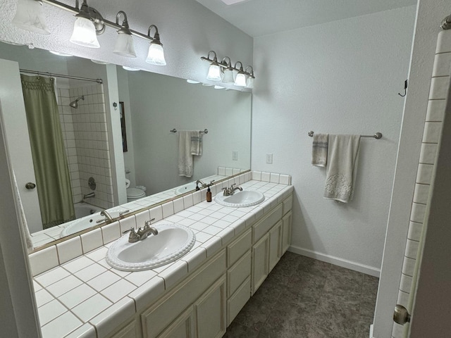 650 N Burgan Ave, Fresno, CA 93727 - full bath with double vanity and shower / bath combination with curtain