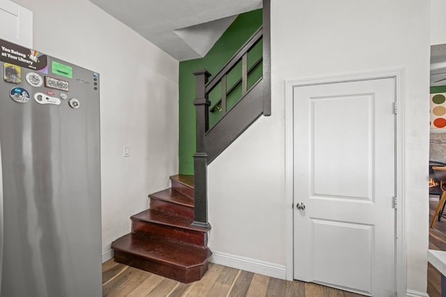 3144 Vista Ave, San Diego, CA 91945 - staircase featuring wood finished floors and baseboards