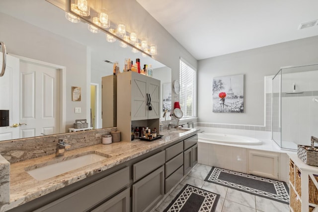 7310 N Katy Ave, Fresno, CA 93722 - bathroom featuring a garden tub, double vanity, a tile shower, and marble finish flooring