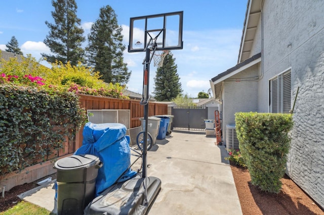 7310 N Katy Ave, Fresno, CA 93722 - fenced backyard with a patio area