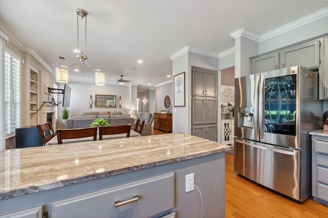 7310 N Katy Ave, Fresno, CA 93722 - kitchen featuring stainless steel fridge with ice dispenser, gray cabinets, crown molding, light wood finished floors, and a ceiling fan