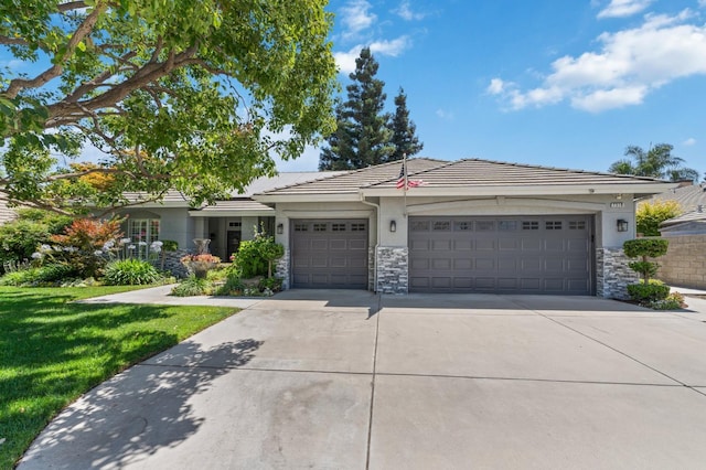 7310 N Katy Ave, Fresno, CA 93722 - ranch-style house with driveway, a garage, stone siding, and a tiled roof